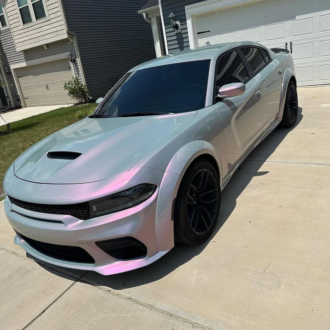 A pearl white car wrap is a high-quality vinyl wrap that gives your vehicle a sleek, glossy finish with a subtle pearlescent shimmer. This type of wrap is designed to mimic the elegance of pearl paint while offering a more cost-effective and reversible option. It consists of multiple layers that create depth and richness, making your car stand out on the road.