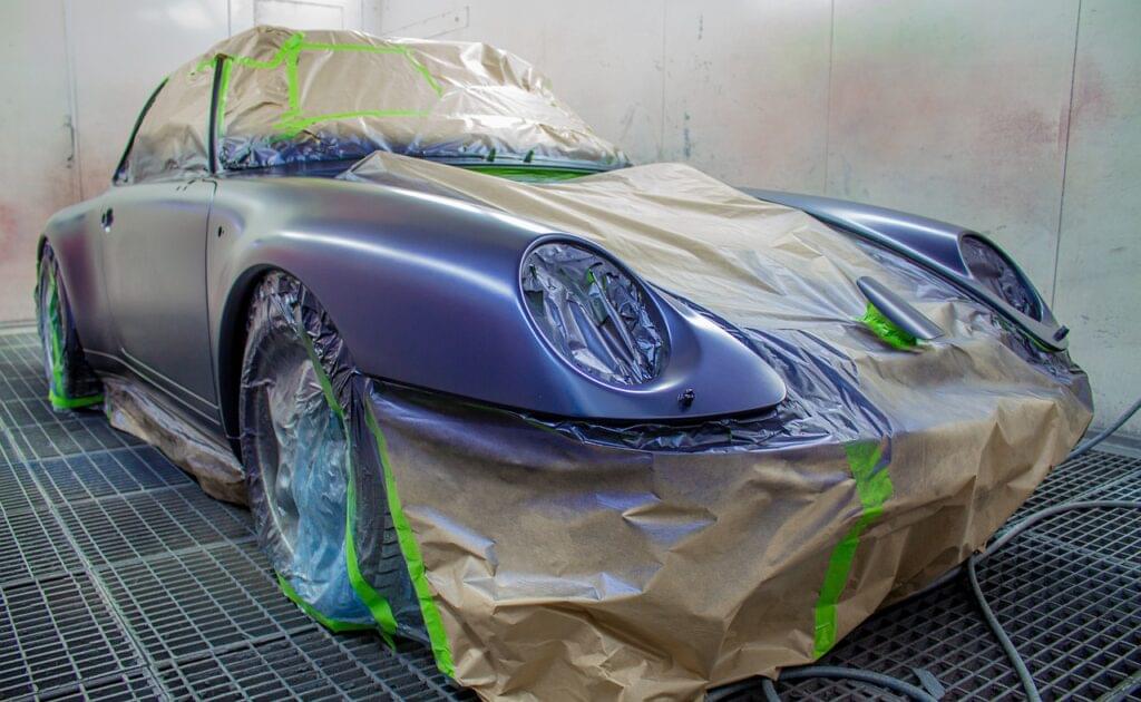 advertisement for a car body wrap shop